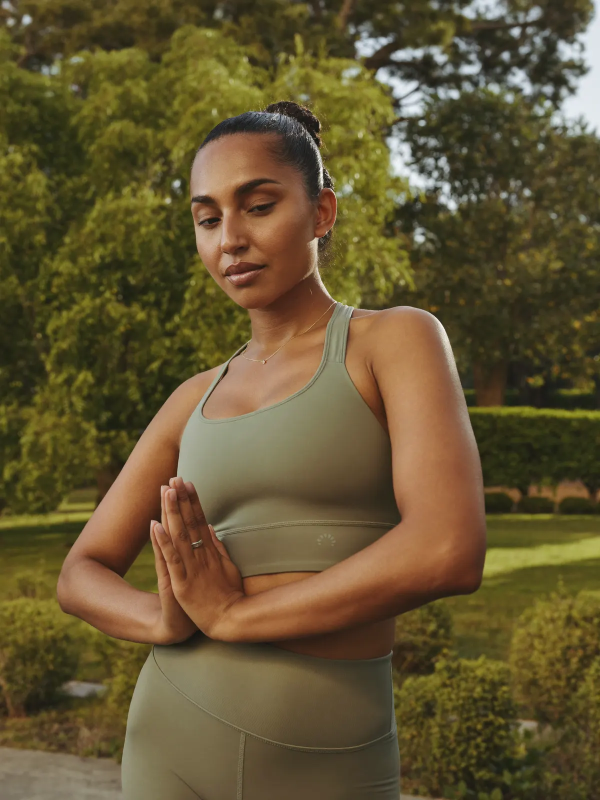 Portrait of a yoga and breathwork coach in a garden